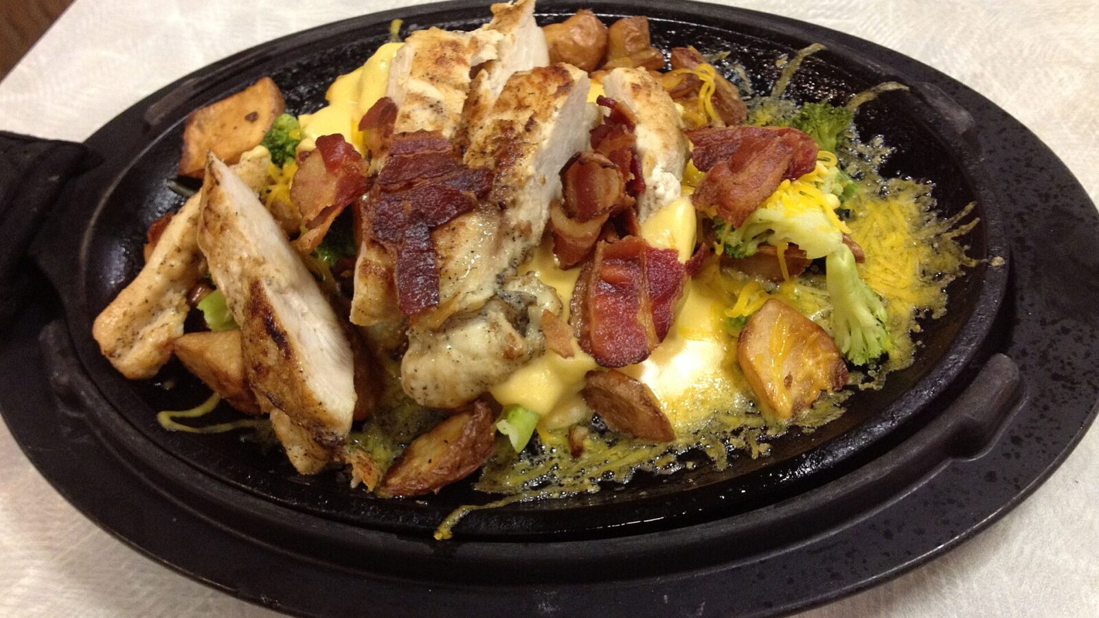 Chicken cooking in a skillet